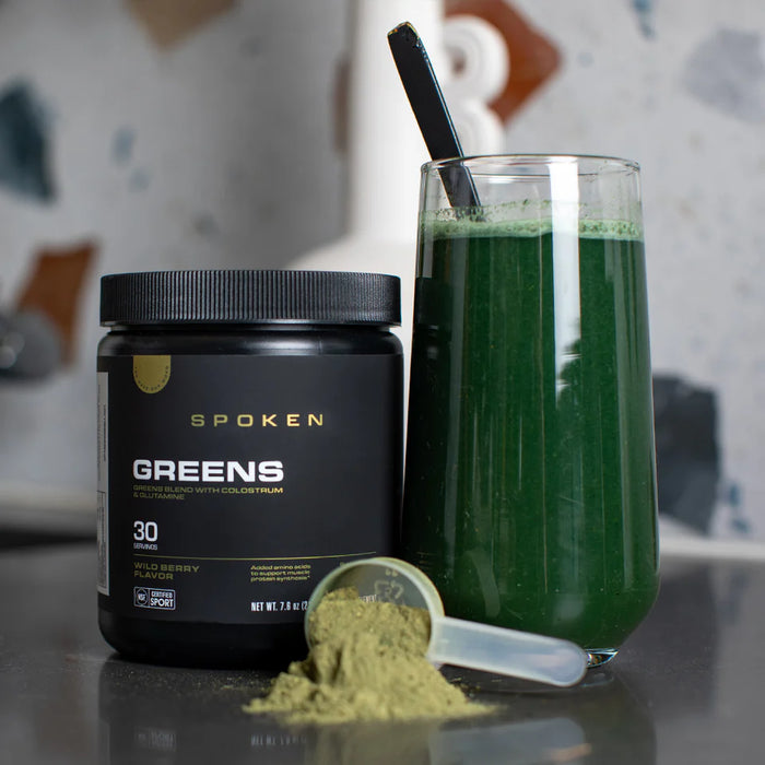 Spoken Nutrition Greens container with mixed drink in lifestyle environment – nutrient-dense greens formula for peak performance and well being. 30 Servings 